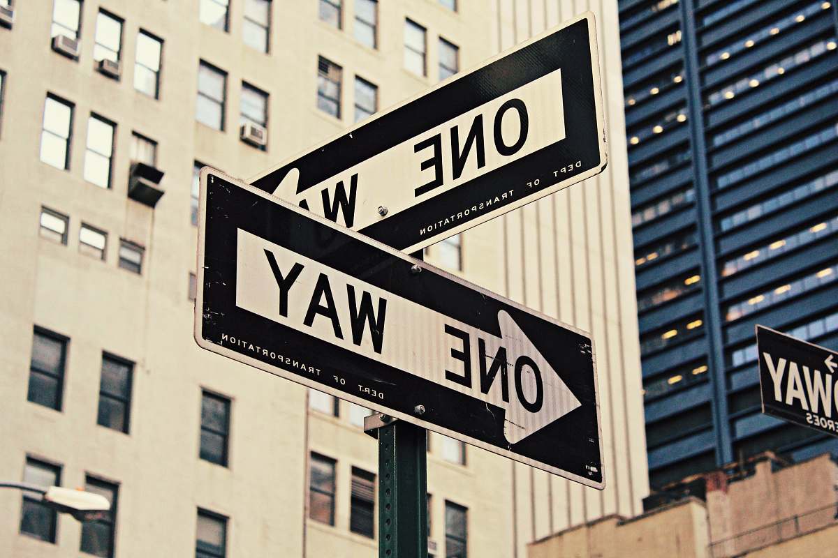 street sign white and black One Way-printed road signages one way